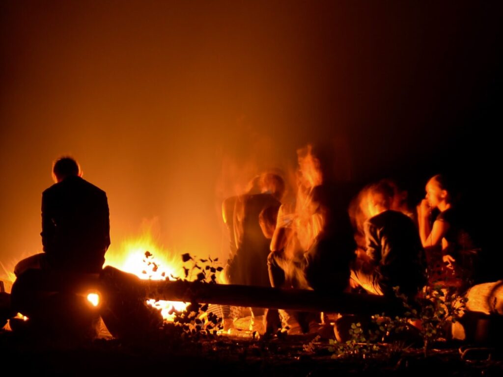 Campfires are a vital part of the camping experience. There is nothing quite like sitting around a fire chatting with friends and family, singing songs and toasting marshmallows after a day’s camping activities. 

This 5 minute read will give you the tools to enjoy a campfire responsibly- for the safety of both the people in your group, the other campers on the site and the environment.

The first thing to remember…

Be sure to check that your campsite allows fires before you leave! 

Lots of campsites actually don’t permit people to have fires and you don’t want the disappointment of finding this out when you arrive. 

You could also check whether the campsite has fire pits, which make setting up a safe fire a lot easier. Lots will only allow you to have fires in fire pits to protect their site. 

Many will sell firewood in the campsite, but if they don’t, a nearby garage is usually your best bet.

Setting up your fire

Where you're lighting your fire or your campsite doesn’t have a firepit, then you can make your own. 

Set up the fire on bare earth, within a circle of stones, at least 10 feet away from any tents or bushes. If you’re camping in a forest you also want to make sure there aren’t any low lying branches immediately above the spot you’re making the fire. If there aren’t any rocks available, then you could also contain the fire within greenwood that you wet down regularly.

Burn baby burn…

Now that you have a good firepit, it’s time to actually make the fire. If you'd like a step-by-step guide go to How to light a campfire. 

When you’re getting wood for your fire, make sure not to cut any down from forests, unless you have permission from the landowner that you’re allowed to do so. Not only can this damage wildlife habitats, but green wood is also not ideal for making fires as it doesn’t burn well. It will get very smokey and not much fun.

Lighting the fire safely

If you’re using a match to light the fire, make sure you throw it into the fire once it has caught light, or put it into a container of water to make sure it goes out. 

When you’re camping in summer or autumn, there’s lots of dry grass around that can easily set light. 

You should also never use lighter fluid, gas or any flammable liquids to start your fire.

To stop escaping flames

Be sure to always keep a bucket of water near in case the fire suddenly needs to be put out, as well as a shovel that be used to throw sand or dirt onto escaping flames. You also want to pay attention to the wind, as a strong gust can cause sparks to fly or even for the fire to spread. On blowy days, keep anything flammable and any unused firewood upwind and at least 4 meters away from the fire.

Keep an eye on kids and pets

Kids love toasting marshmallows and whittling sticks whilst sitting around the campfire. 

But another important part of camping is teaching children how to be safe around the fire. You could make the fire with your kids, showing them how it can be done safely, and then teach them how to maintain it responsibly. 

Teach them to stop, drop and roll if they ever find themselves in a situation when their clothes set on fire. 

In some countries such as Australia and USA, they teach the stop, drop, roll as part of the school curriculum. Its a good idea to practice this with young children as make it part of their learning to camp rules. 

If they ever needed to do this,  they wouldn't panic and just carry out these 3 steps more naturally.

If you’re camping with pets that you know can be jumpy or unpredictable then be sure to keep them on your lap or by your side around the campfire. You could also keep them on a short leash.

Set rules that work for your family and the ages of children you have. 

When we were younger, we had a rule that sticks poked in the fire had to stay below knee height to avoid red hot pokers being waved in the air around faces and eyes. 

We also had a rule of no running around the fire, so children and adults moving around the campfire had to do it outside of the ring of chairs to avoid anyone tripping too close to the fire. 

Make sure all the children and adults in your party know the fire rules, especially if they haven’t camped with fires before.

Don’t leave the campfire alone!

Make sure to never leave a campfire unattended, as a breeze can cause it to spread very quickly. 

Even if you’re heading off for a short trip, make sure anyone left at the camp knows to keep an eye on the fire. Or, if no one will be around then properly extinguish the fire- it can easily be relit when you return.

Putting out campfires

To put the fire out properly, dump water on it, then stir the ashes around to expose any embers that are still burning and finally dump more water on the fire. 

A good rule of thumb is that if it is too hot to touch then the fire shouldn’t be left alone.