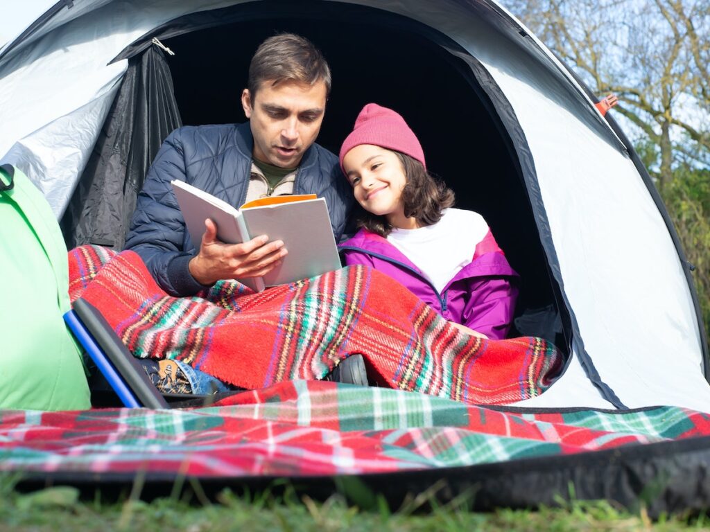 Camping With Kids - What To Pack.
When you’re camping with kids, packing the right stuff is a key part of preparation for the trip. It may seem like a lot to keep in mind when you’re also packing everything you need for sleeping and cooking. 

My main tip is to make a checklist, as it’s the best way to make sure you don’t forget anything. 

Also keep a few things in mind when you’re packing for camping. You want to bring the basics (like clothes, rainy weather gear and shoes they can walk in), camping games, and a craft bag.

The basics

Obviously, pack clothes for each child. If they’re old enough to pack for themselves, I would recommend doing a quick check through their bag. You don’t want to have to waste time buying them socks from the supermarket when you could be relaxing around the campfire! 

Another thing you definitely don’t want to forget is their favourite toy for bedtime. As kids can sometimes struggle to adjust to the new environment, their favourite toy will help them get to sleep more easily for the first few nights. 

Also make sure to bring shoes kids can slip on, like flipflops or wellies, for late night toilet trips. 

Another thing that is easy to forget is your child’s favourite book, which will also help with bedtime.

If you forget a book then you can always fall back on a made up story at night by the campfire or when they are snuggled up in their sleeping bag.

Camping fun

Packing some games kids can play will help to stop them from sitting on their phones for the whole trip, and get them playing in the incredible UK countryside. 

Why not bring a frisbee, which is a great icebreaker for kids camping with other kids they don’t know very well. 

You could also bring a badminton set, a football or rugby ball for more sporty kids. 

Children can have loads of fun playing with walkie talkies, so why not pack a few for them to play with. For loads of ideas for fun games kids can play with walkie talkies, check here. 

You could also bring a bubble wand, these are great for those hot summer days camping! 

Torches are another must so that kids can play together in the evenings. 

For loads more tips on how to keep children occupied on your camping trip, check out how to entertaining children when camping.

What to pack for trips out of the campsite

When you pack for camping, you’re also packing for any trips your family takes out of the campsite. My rule of thumb is – always pack swim stuff and towels. You’ll need it for beach trips, but even if you’re not near a beach, you may find a lake or need to find shelter in a leisure centre for an afternoon. Don’t forget goggles, and any beach toys you have at home. Buckets and some good quality spades can keep kids busy making sea defences and castles for hours. 

Also make sure to bring a rucksack for each child if you’re planning on going on some long walks. It means that they can pack their own essentials, extra layers and snacks (and also means you don’t have to carry everyone’s stuff for them!).

The craft bag

Packing one bag with all of the crafting bits and bobs in it is a great way to encourage your children to be more creative and also to make sure that you don’t forget anything. 

Be sure to bring pens, pencils, paper and sketchbooks. You could also bring crayons to make leaf rubbings and some glue so that kids can make collages using dried leaves or anything else that they find in the countryside around them. 

Another great thing to bring is colouring books, they are great for keeping kids occupied, especially on a rainy day!

What to pack for camping with a baby or toddler

If you’re camping with a baby or toddler, then packing the right kit is even more important. You’ll obviously need wet wipes and nappies, as well as a changing mat from home. However, for an easier camping experience, you could invest in a 3 in 1 bassinet, nappy carrier and carrier station. They come as backpacks that can be transformed really easily into a carry cot, and lots of pockets for nappies and snacks. Y

ou could also bring a hammock, which is great for feeding and daytime naps outside of the tent.

Be sure to bring a child shoulder carrier so that your baby can come with you on walks - they love watching the world from above! 

If you’re bottle-feeding, then why not consider bringing biodegradable single-use bottles. 

You could also bring food pouches or ready-made meals so that you don’t need to stress about cooking! 

For more tips on camping with babies in general, check out my blog Camping with babies and toddlers. 

The right packing sets the foundation for an incredible trip. But here’s no need to stress about it.