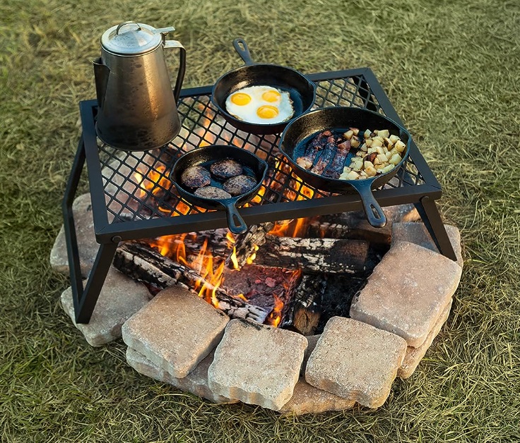 What to pack for campfire cooking. Here's a guide to show you that there's nothing worry about and some tips and tricks to make is all seem easy. 

Cooking over your campfire can be a daunting prospect for many less experienced campers, but making a campfire and cooking meals over it can be surprisingly simple. It is a great way to become more self-sufficient and have an authentic back-to-basics camping experience. 

I’d recommend starting with simple recipes using tin foil packets as well as having barbecues, then build up to some more complex recipes. The first step towards successful campfire cooking is having the right equipment. I’ll go through the top 12 items you should pack for campfire cooking to help you get started (with a printable campfire cooking checklist at the end).
To successfully cook over your fire let it burn down to the white-hot embers, as this is an easier heat source to control. Cooking over bare flames will only blacken your pots and pans and burn your food. 

To cook most meals, you’ll need a grate, which you can place a couple of inches over the fire if the grate has legs, or if not then prop up using some bricks or rocks. You can then place your pots and pans over the campfire and start cooking. 

This is also the perfect set-up for a camping barbecue. For loads of useful tips and recipes to help you have a top-notch BBQ, be sure to look at Burgers and Hot dogs all round.

Cooking utensils 

For any meal cooked over the campfire, you’ll need at least some of these utensils. For barbecuing, you’ll definitely need some tongs (longer tongs can also be useful for picking tin foil packets out of the campfire), and a sharp knife with a sheaf. For cooking in general you could also bring along some wooden spoons, a spatula, ladle, potato masher, bottle opener or scissors- take your pick. 

A good tip is to leave a list in your camping box for which items you're going to take out of your kitchen drawer. That way you know each time you go camping you'll be bringing all the right things to help you campfire cooking go smoothly.

Tin foil 

Some sturdy aluminium foil is vital for campfire cooking. Making foil packets is one of the easiest ways to cook a range of different meals over your campfire. Why not try stuffed bananas wrapped in foil and cooked in the fire- one of my absolute favourite camping deserts. Tucking into a warm banana with melty marshmallows and chocolate is the perfect way to end your day- whether you’ve had a busy day full of camping activities, or you’ve spent it lounging in a hammock in the forest. 

If you want some more indulgent campfire dessert ideas then check out, Sweet treats and desserts you can cook on your campfire.   

The famous campfire baked potato is another great option for cooking using foil. It can be enjoyed with the classic grated cheese and baked beans, or even with a delicious spicy chilli cooked over your campfire. 

